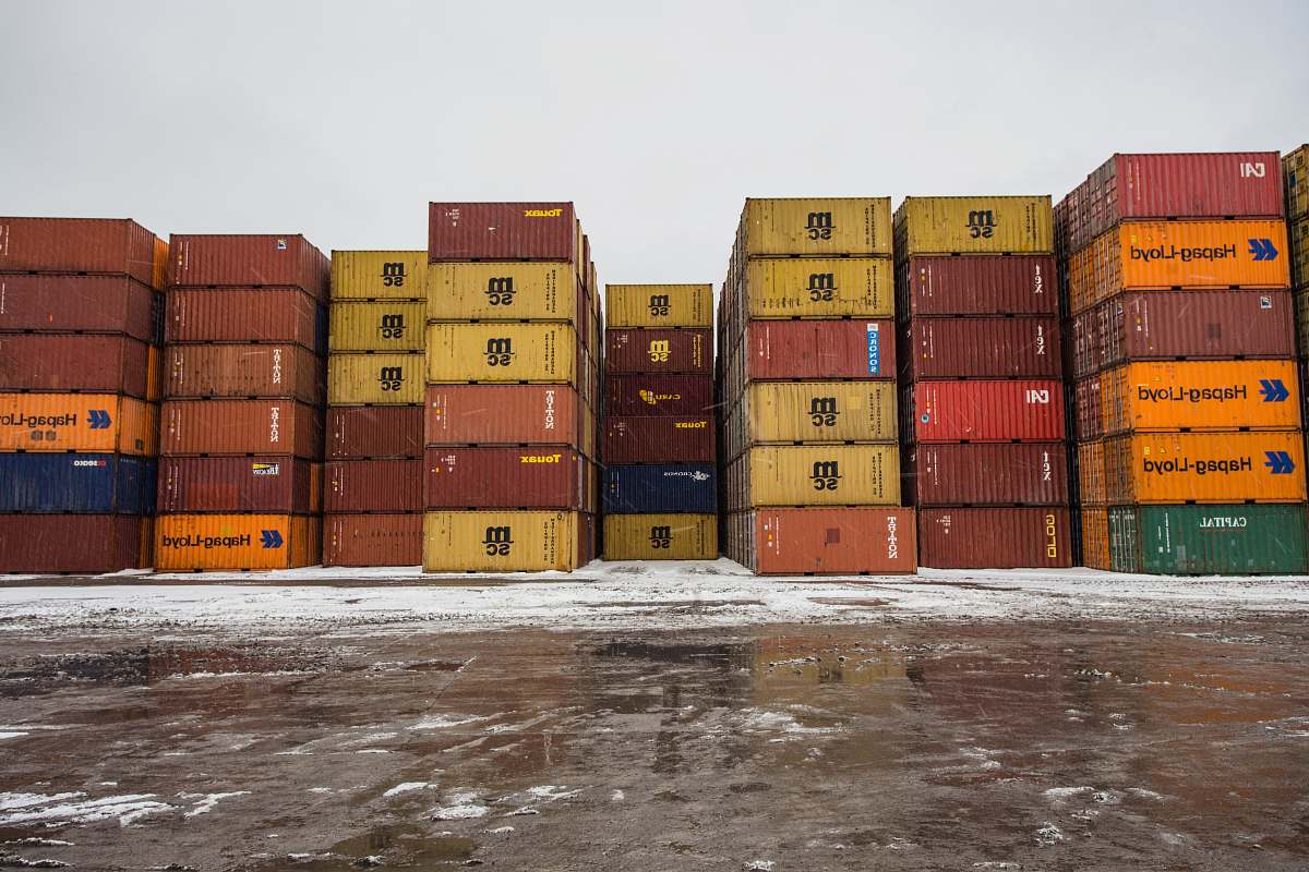 montreal assorted-colored cargo container lot during daytime transportation